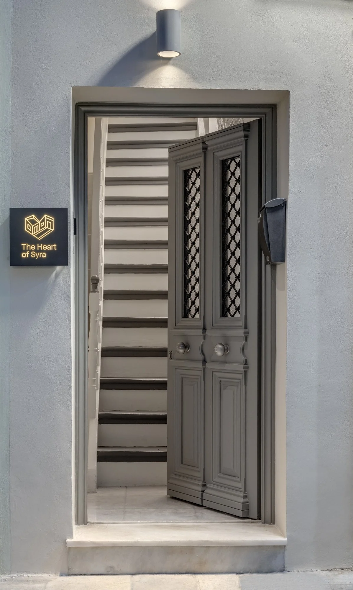 Entry passage and staircase leading into the house