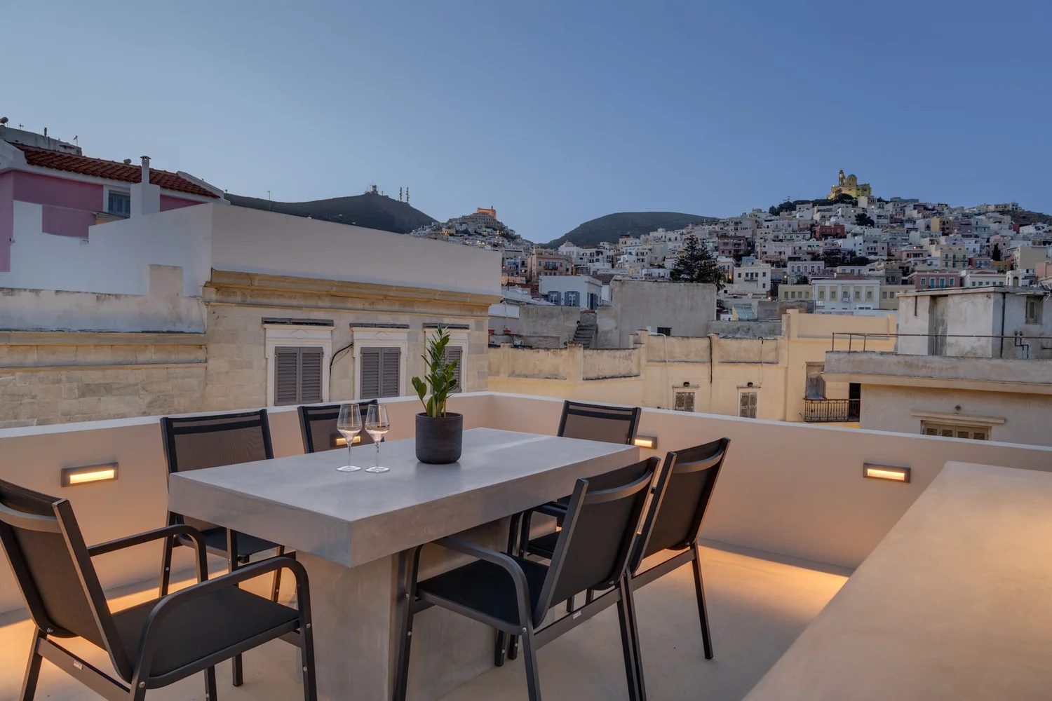 Upper terrace prepared for dinner in the blue hour