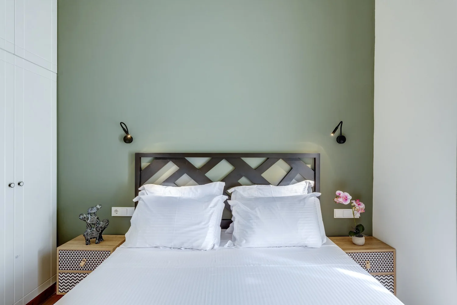 Timber headboard and reading lights in bedroom one