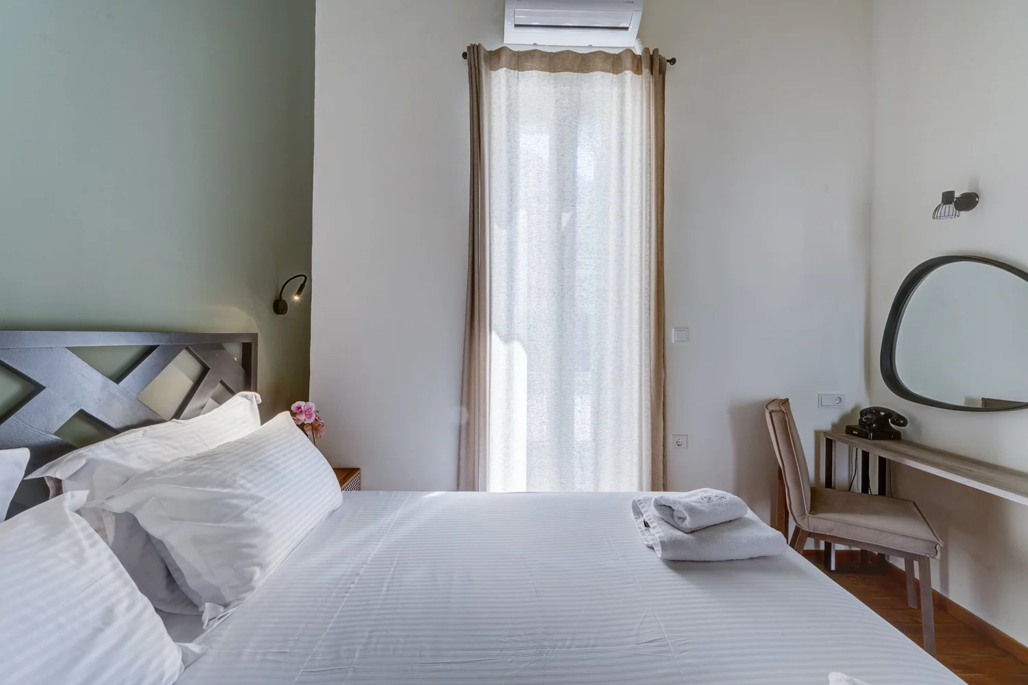 Bedroom one in soft natural morning light